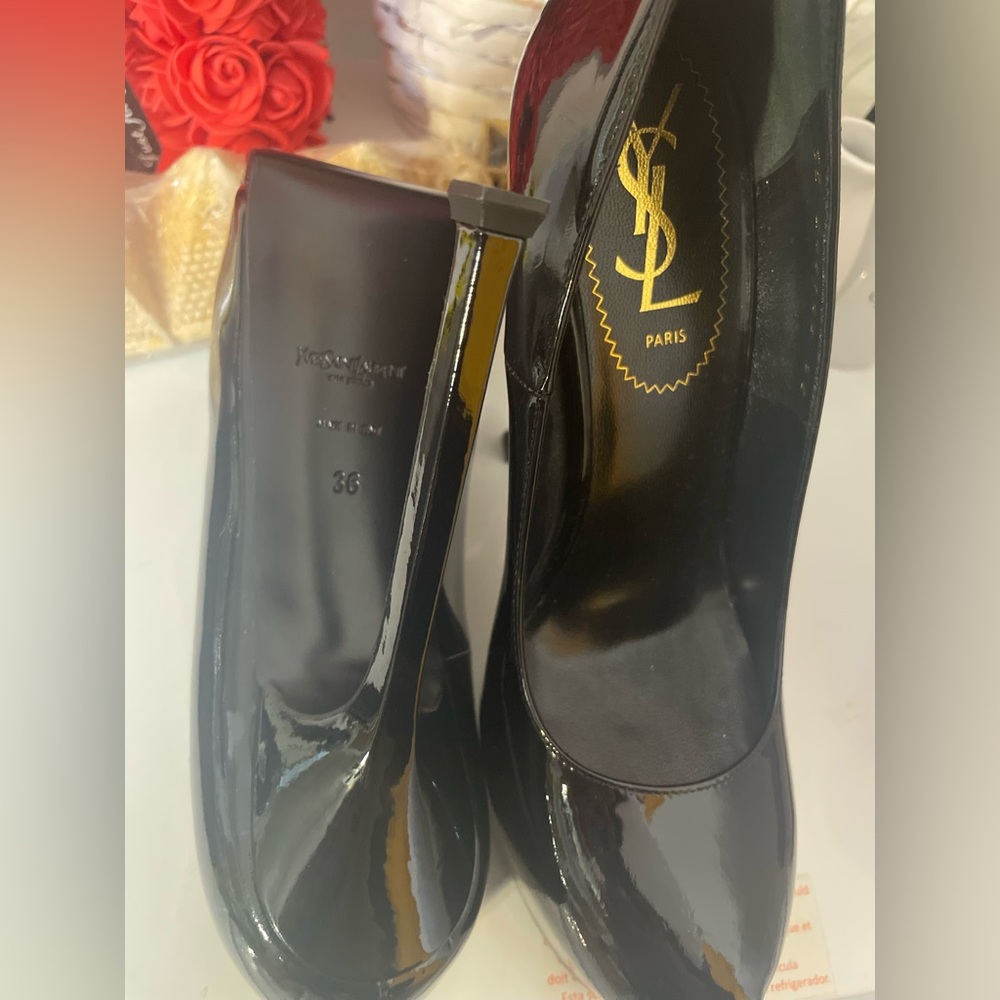 Yves Saint Laurent women’s black patent leather high heels, size 6.